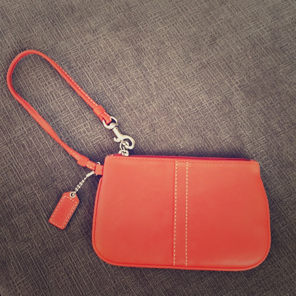 Coach burnt orange leather wristlet